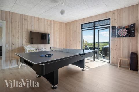 Neben den vielen schönen Stunden, die man im Poolbereich des Hauses verbringen kann, bietet das Luxusferienhaus 604 auch Spielevergnügen bei Billard/Tischtennis und Darts