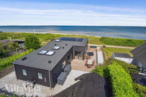 Diese schicke Haus mit Whirlpool Nr. 606 mit Platz für 6 Personen liegt in Ostjütland