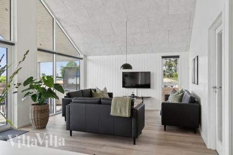 Die Couch im Luxusferienhaus Nr. 614 in Fünen und seine Inseln lädt zu Gesellschaftsspielen oder zu Kinoabenden ein.