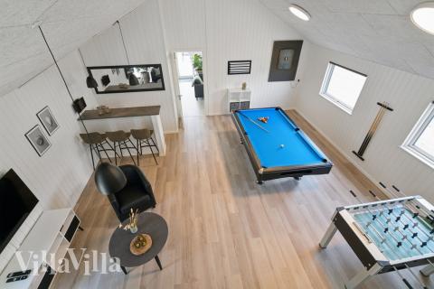 Neben den vielen schönen Stunden, die man im Poolbereich des Hauses verbringen kann, bietet das Luxusferienhaus 614 auch Spielevergnügen bei Billard/Tischtennis und Darts