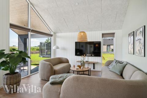 Die Couch im Luxusferienhaus Nr. 618 in Fünen und seine Inseln lädt zu Gesellschaftsspielen oder zu Kinoabenden ein.