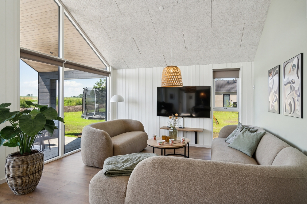 Die Couch im Luxusferienhaus Nr. 618 in Fünen und seine Inseln lädt zu Gesellschaftsspielen oder zu Kinoabenden ein.