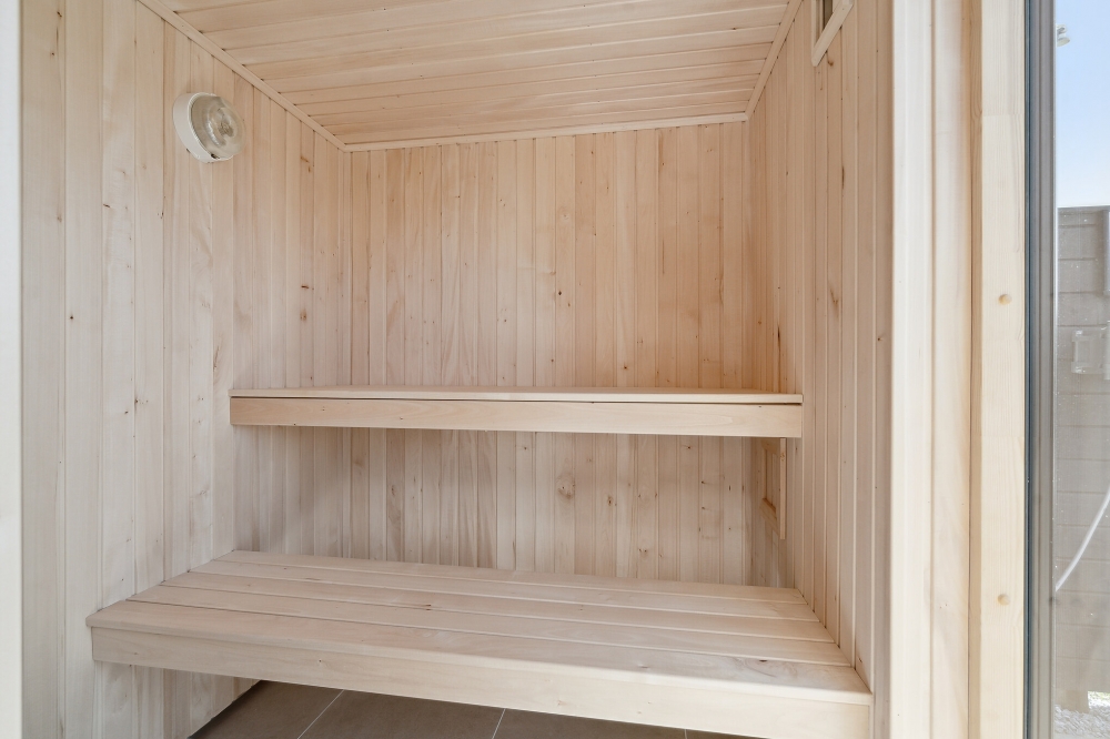 Genießen Sie die heiße Sauna im Luxusferienhaus Nr. 618 für 16 Personen