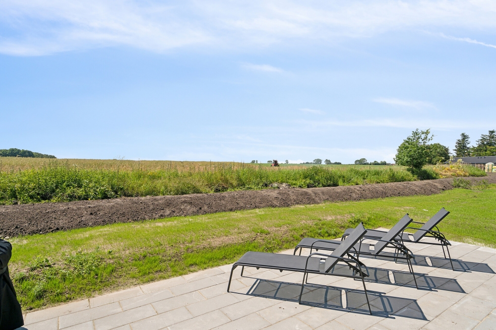 Genießen Sie einen Grillabend auf der Terrasse des Luxusferienhauses Nr. 618 in Fünen und seine Inseln