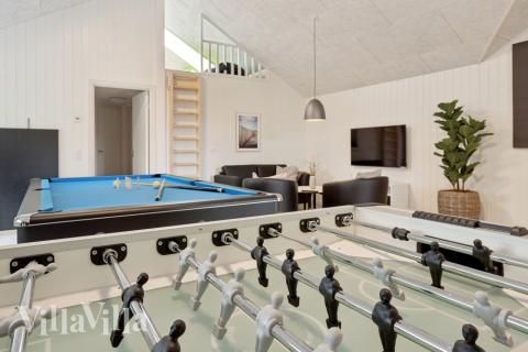 Neben den vielen schönen Stunden, die man im Poolbereich des Hauses verbringen kann, bietet das Luxusferienhaus 624 auch Spielevergnügen bei Billard/Tischtennis und Darts