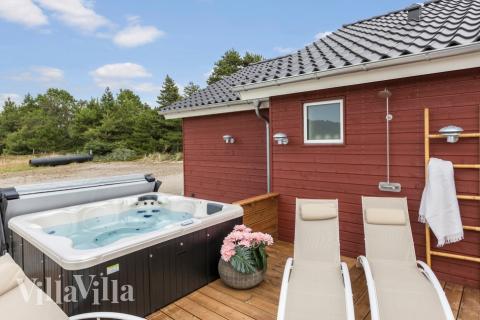 Genießen Sie den warmen Whirlpool im Luxusferienhaus Nr. 629 in Südjütland