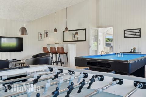 Neben den vielen schönen Stunden, die man im Poolbereich des Hauses verbringen kann, bietet das Luxusferienhaus 633 auch Spielevergnügen bei Billard/Tischtennis und Darts