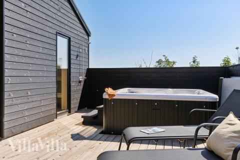 Genießen Sie den warmen Whirlpool im Luxusferienhaus Nr. 634 in Nordjütland