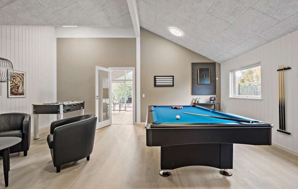 Neben den vielen schönen Stunden, die man im Poolbereich des Hauses verbringen kann, bietet das Luxusferienhaus 638 auch Spielevergnügen bei Billard/Tischtennis und Darts