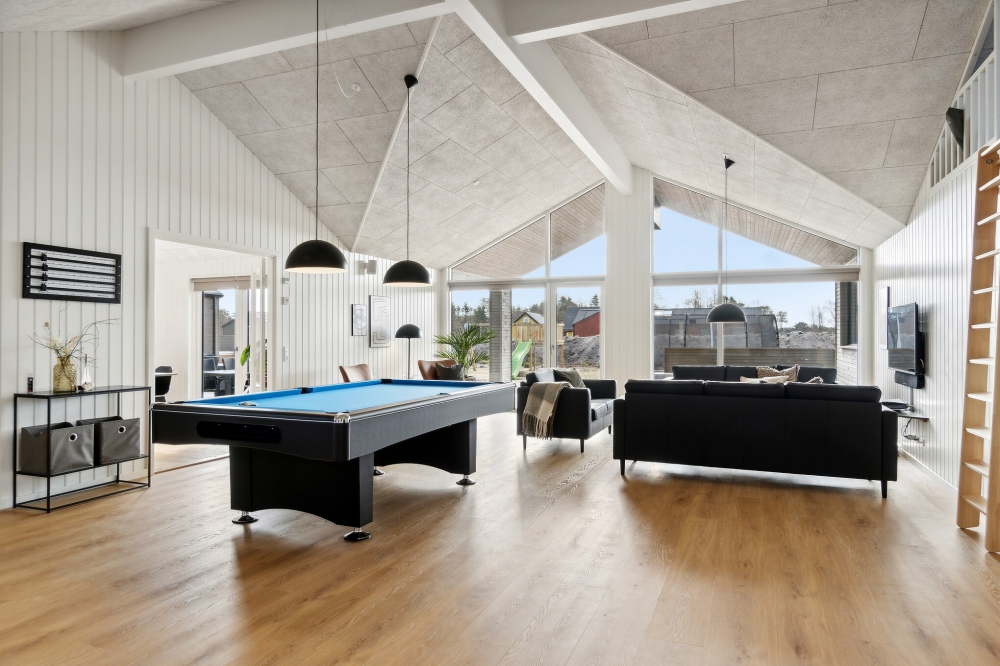 Neben den vielen schönen Stunden, die man im Poolbereich des Hauses verbringen kann, bietet das Luxusferienhaus 806 auch Spielevergnügen bei Billard/Tischtennis und Darts