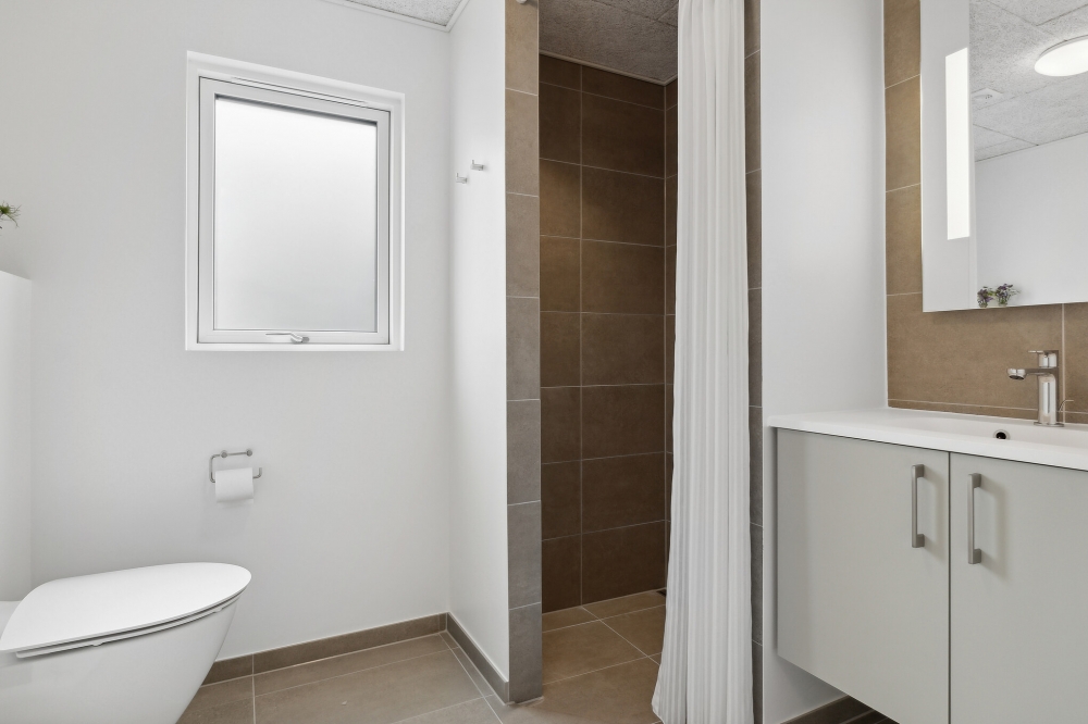 Eines der Badezimmer im Luxusferienhaus Nr. 822