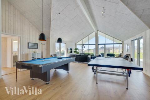 Das Luxusferienhaus 830 für 26 Personen hat einen großen Aktivitätsraum mit u. a. Billard und Darts