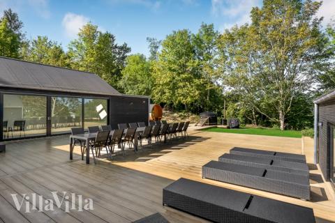 Genießen Sie einen Grillabend auf der Terrasse des Luxusferienhauses Nr. 674 in Nordseeland