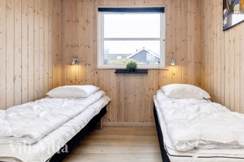 Eines der 6 Schlafzimmer im Luxusferienhaus Nr. 218