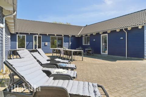 Genießen Sie einen Grillabend auf der Terrasse des Luxusferienhauses Nr. 314 in Lolland/Falster/Mön