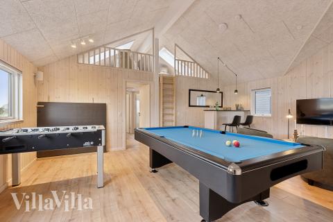 Neben den vielen schönen Stunden, die man im Poolbereich des Hauses verbringen kann, bietet das Luxusferienhaus 655 auch Spielevergnügen bei Billard/Tischtennis und Darts
