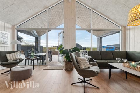 Die Couch im Luxusferienhaus Nr. 655 in Fünen und seine Inseln lädt zu Gesellschaftsspielen oder zu Kinoabenden ein.