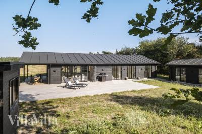 Diese schicke Haus mit Whirlpool Nr. 693 mit Platz für 11 Personen liegt in Nordseeland