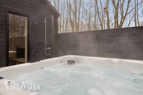 Genießen Sie den warmen Whirlpool im Luxusferienhaus Nr. 664 in Südjütland