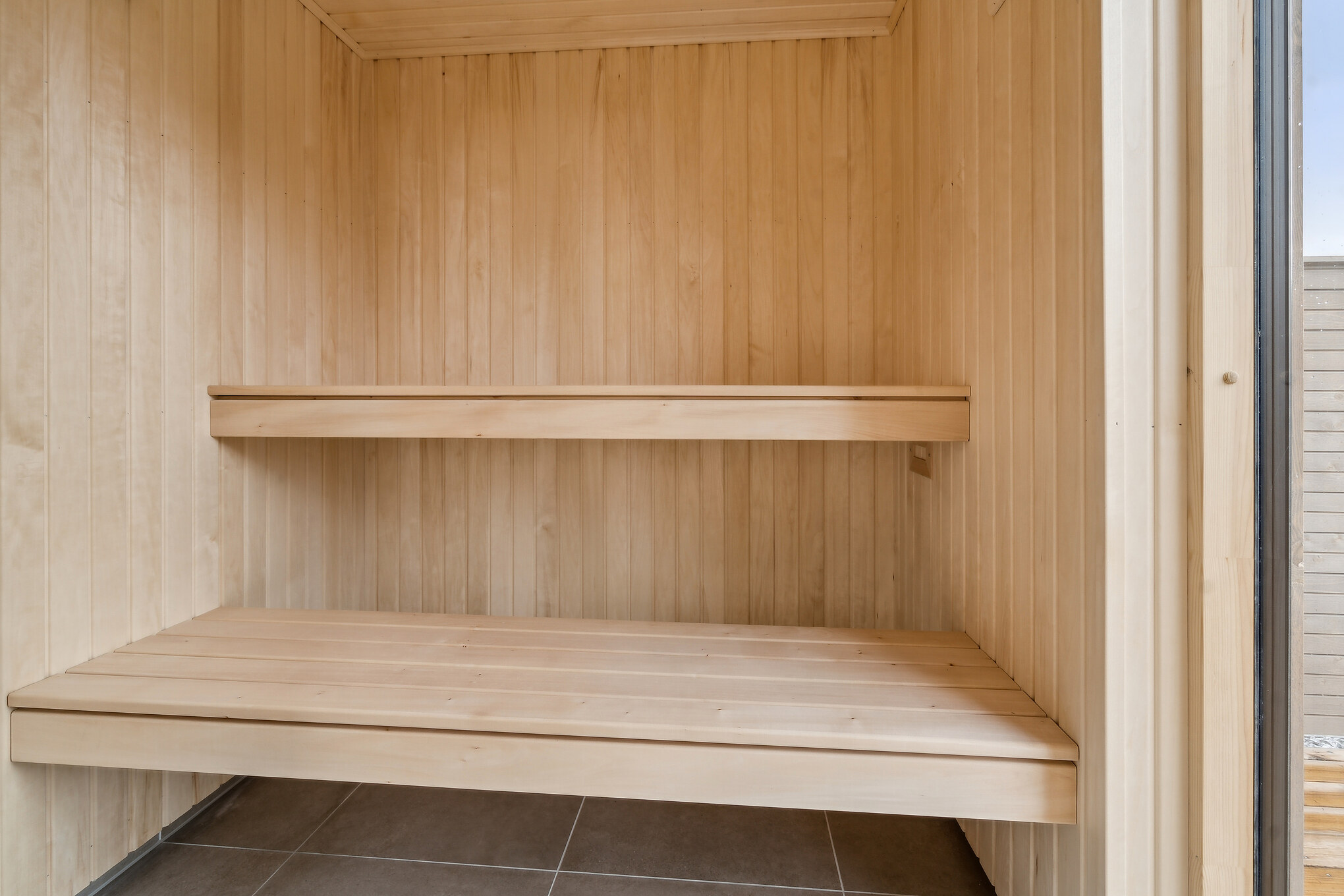 Genießen Sie die heiße Sauna im Luxusferienhaus Nr. 648 für 14 Personen