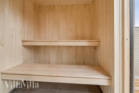 Genießen Sie die heiße Sauna im Luxusferienhaus Nr. 648 für 14 Personen