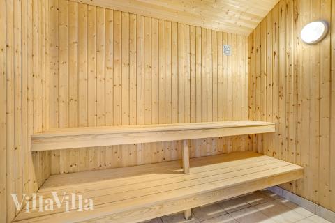 Genießen Sie die heiße Sauna im Luxusferienhaus Nr. 602 für 26 Personen