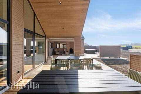 Genießen Sie einen Grillabend auf der Terrasse des Luxusferienhauses Nr. 648 in Fünen und seine Inseln