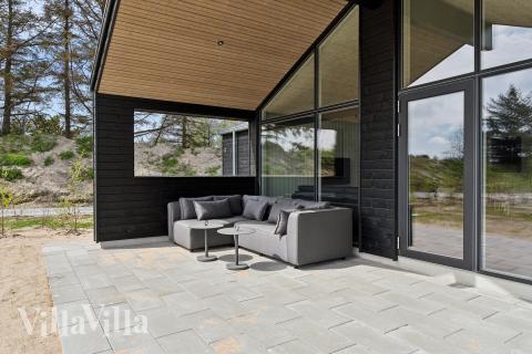 Genießen Sie einen Grillabend auf der Terrasse des Luxusferienhauses Nr. 910 in Lolland/Falster/Mön