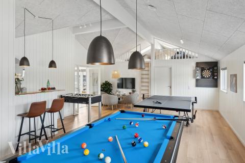 Neben den vielen schönen Stunden, die man im Poolbereich des Hauses verbringen kann, bietet das Luxusferienhaus 656 auch Spielevergnügen bei Billard/Tischtennis und Darts