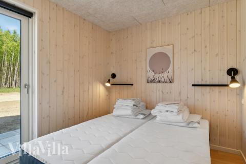 Eines der 9 Schlafzimmer im Luxusferienhaus Nr. 809