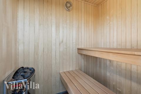 Genießen Sie die heiße Sauna im Luxusferienhaus Nr. 657 für 20 Personen