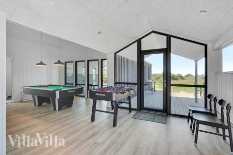 Neben den vielen schönen Stunden, die man im Poolbereich des Hauses verbringen kann, bietet das Luxusferienhaus 909 auch Spielevergnügen bei Billard/Tischtennis und Darts