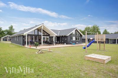 Dieses schöne Poolhaus Nr. 388 mit Platz für 16 Personen liegt in Nordseeland