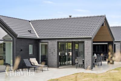 Dieses schöne Poolhaus Nr. 610 mit Platz für 18 Personen liegt in Westjütland