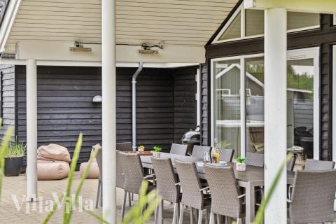 Genießen Sie einen Grillabend auf der Terrasse des Luxusferienhauses Nr. 458 in Westjütland