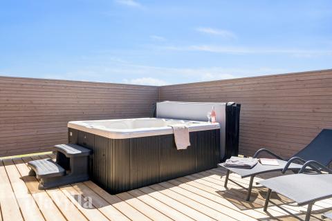 Genießen Sie den warmen Whirlpool im Luxusferienhaus Nr. 671 in Fünen und seine Inseln