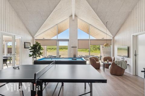 Neben den vielen schönen Stunden, die man im Poolbereich des Hauses verbringen kann, bietet das Luxusferienhaus 671 auch Spielevergnügen bei Billard/Tischtennis und Darts