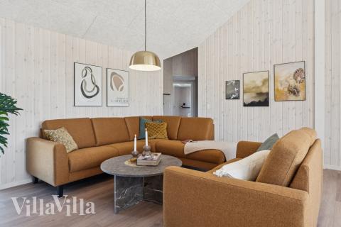 Die Couch im Luxusferienhaus Nr. 671 in Fünen und seine Inseln lädt zu Gesellschaftsspielen oder zu Kinoabenden ein.