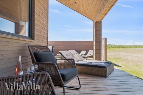 Genießen Sie einen Grillabend auf der Terrasse des Luxusferienhauses Nr. 671 in Fünen und seine Inseln