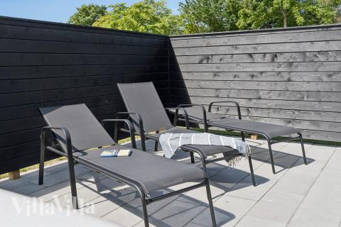 Genießen Sie einen Grillabend auf der Terrasse des Luxusferienhauses Nr. 644 in Lolland/Falster/Mön