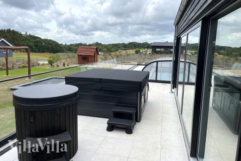 Genießen Sie den warmen Whirlpool im Luxusferienhaus Nr. 686 in Limfjord