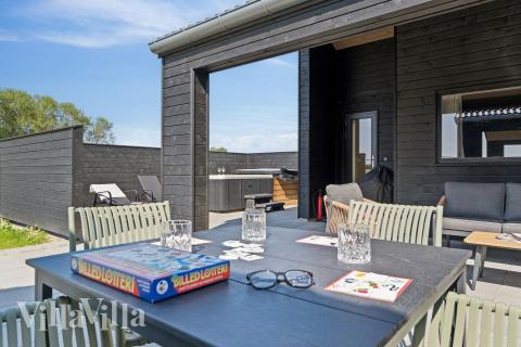 Genießen Sie einen Grillabend auf der Terrasse des Luxusferienhauses Nr. 667 in Fünen und seine Inseln