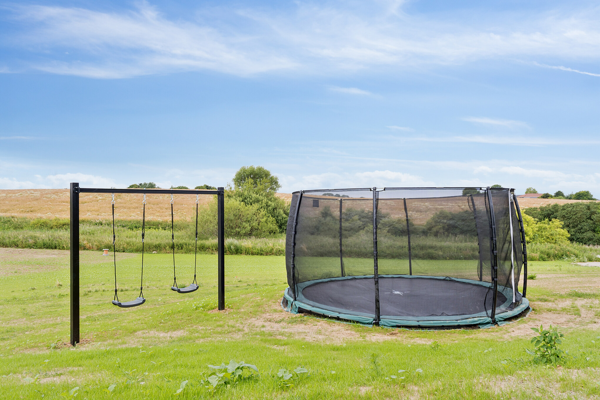 Zu dem attraktiven Ferienhaus Nr. 668 in Fünen und seine Inseln gehört auch ein tolles Angebot im Außenbereich, z. B. Spieleturm und Schaukeln
