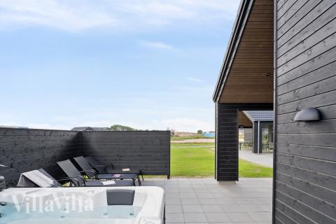 Genießen Sie den warmen Whirlpool im Luxusferienhaus Nr. 695 in Fünen und seine Inseln