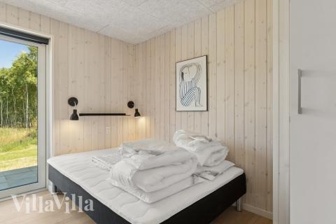 Eines der 6 Schlafzimmer im Luxusferienhaus Nr. 811