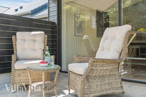 Genießen Sie einen Grillabend auf der Terrasse des Luxusferienhauses Nr. 815 in Ostjütland
