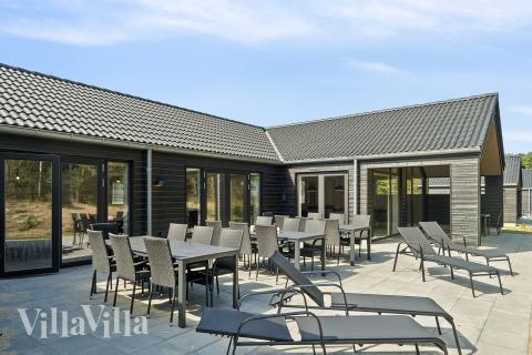 Genießen Sie einen Grillabend auf der Terrasse des Luxusferienhauses Nr. 817 in Ostjütland