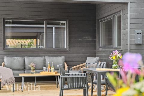 Genießen Sie einen Grillabend auf der Terrasse des Luxusferienhauses Nr. 672 in Westjütland