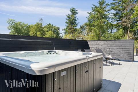 Genießen Sie den warmen Whirlpool im Luxusferienhaus Nr. 616 in Fünen und seine Inseln