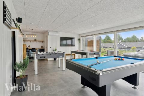 Neben den vielen schönen Stunden, die man im Poolbereich des Hauses verbringen kann, bietet das Luxusferienhaus 686 auch Spielevergnügen bei Billard/Tischtennis und Darts